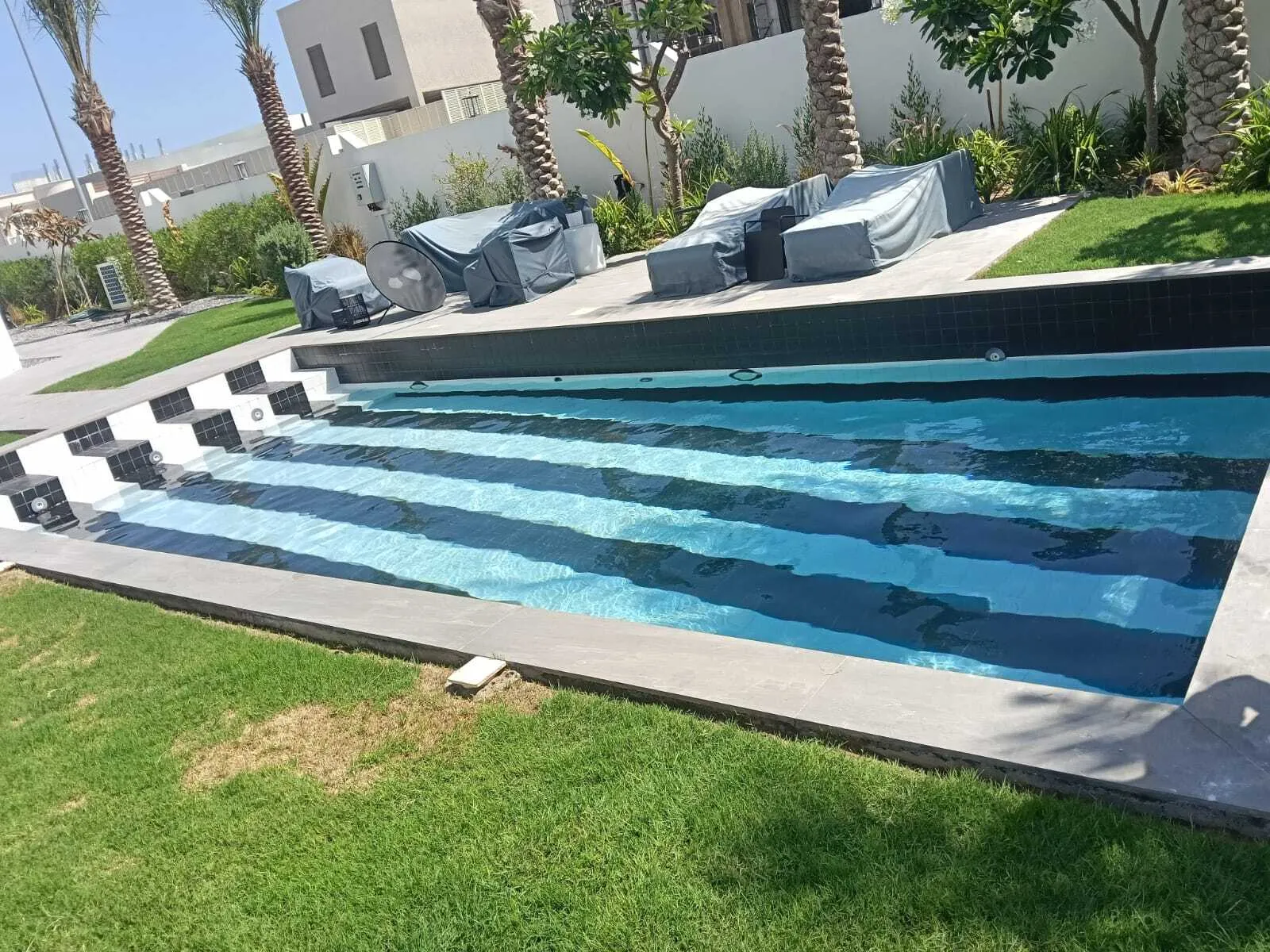 Sweet water tanker filling a villa swimming pool in Dubai Hills
